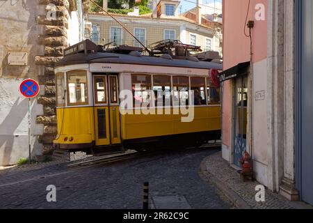Tram number 12 in the narrow street of Calcada, de Santo Andre, Lisbon Stock Photo