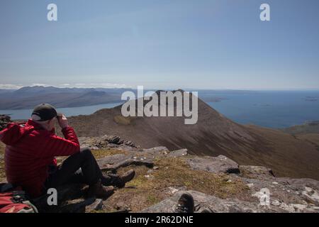 There is nothing more satisfying than a dry, windy (no midges) day in the NW Highlands - Ben Mor Coigagh hike. Stock Photo