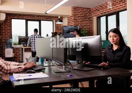 Tech enginners programming server code algorithm on computer, typing sever data in it agency office. Software developer working on new user interface with online system to create algorithm. Stock Photo