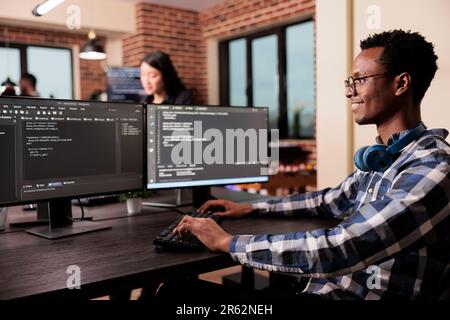 Software developer working on new user interface with online system to create algorithm in it agency office. System engineer programming html code algorithm on computer, typing sever data Stock Photo