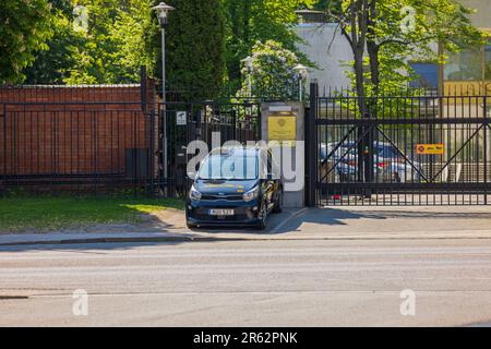 View of security car in front of entrance to Russian Embassy metal fence. Stockholm, Sweden. Stock Photo