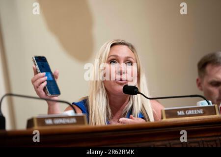 Washington, United States. 06th June, 2023. Rep. Marjorie Taylor Greene, R-GA, holds up the CPB One app on her phone during a House Committee on Homeland Security Subcommittee on Border Security and Enforcement hearing on the Department of Homeland Security and Title 42 at the U.S. Capitol in Washington, DC on Tuesday, June 6, 2023. The app serves as a gateway to different Customs and Border Patrol services, including as a portal to seek asylum at the U.S.- Mexico border. Photo by Bonnie Cash/UPI Credit: UPI/Alamy Live News Stock Photo