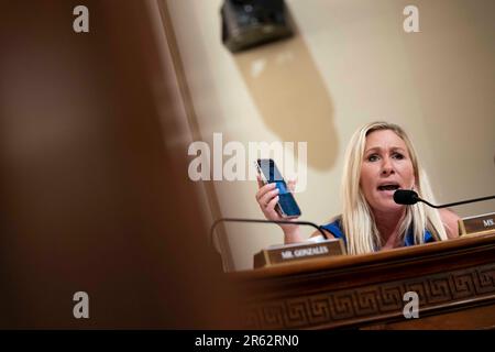 Washington, United States. 06th June, 2023. Rep. Marjorie Taylor Greene, R-GA, holds up the CPB One app on her phone during a House Committee on Homeland Security Subcommittee on Border Security and Enforcement hearing on the Department of Homeland Security and Title 42 at the U.S. Capitol in Washington, DC on Tuesday, June 6, 2023. The app serves as a gateway to different Customs and Border Patrol services, including as a portal to seek asylum at the U.S.- Mexico border. Photo by Bonnie Cash/UPI Credit: UPI/Alamy Live News Stock Photo