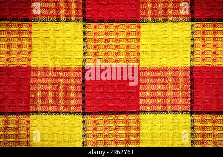 Texture material rag. Red and yellow fabric background checkered. Stock Photo