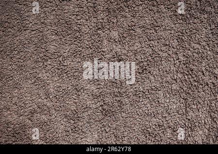 Terry towel texture. Close-up brown material structure, may be used as background. Stock Photo