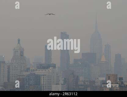 New York, United States. 06th June, 2023. The Manhattan skyline is barely visible hours before sunset as it is enveloped in smoke from continued wildfires in Canada on Tuesday June 6, 2023 in New York City. Millions of people in the eastern United States faced unhealthy air quality conditions on Tuesday, as smoke from wildfires in eastern Canada wafts over much of the country. Photo by John Angelillo/UPI Credit: UPI/Alamy Live News Stock Photo