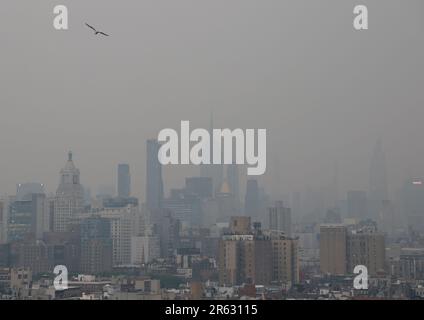 New York, United States. 06th June, 2023. The Manhattan skyline is barely visible hours before sunset as it is enveloped in smoke from continued wildfires in Canada on Tuesday June 6, 2023 in New York City. Millions of people in the eastern United States faced unhealthy air quality conditions on Tuesday, as smoke from wildfires in eastern Canada wafts over much of the country. Photo by John Angelillo/UPI Credit: UPI/Alamy Live News Stock Photo