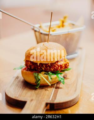 Gourmet American-Style Breaded Chicken Burger and Fries Stock Photo