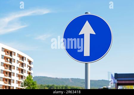 Post with traffic sign Proceed Straight Ahead Only outdoors on sunny day, space for text Stock Photo