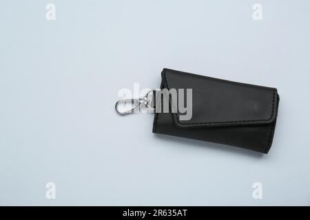 Stylish leather keys holder on light grey background, top view. Space for text Stock Photo