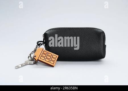 Leather case with keys on light grey background Stock Photo