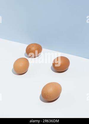 Easter pattern made of eggs on bright background. Minimal healthy food concept. Creative cooking composition. Stock Photo