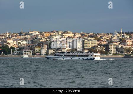 Looking across the Strait of Bosphorus from Beyoglu on the European side to Uskudar on the Asian side of Istanbul, Turkiye / Turkey. Stock Photo