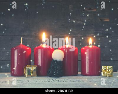 Four red Advent candles on a rustic wooden background, First candle is burning, Christmas concept background Stock Photo