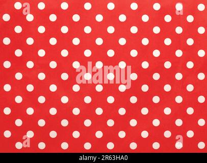Paper texture with white dots on a red background, Christmas or seasonal background, high resolution Stock Photo