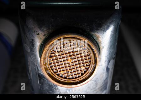 The diffuser in the faucet is clogged and corroded close-up. Old plumbing fixtures in the house Stock Photo
