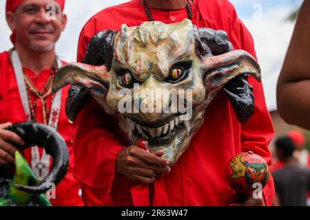 June 16, 2022, San Francisco de Yare, Venezuela: A Yare Dancing Devil shows his mask attached to his chest. Every year on the ninth Thursday after Holy Thursday the Diablos de Yare dance to celebrate Corpus Christi day.Intangible Cultural Heritage of Humanity declared by UNESCO in 2012. Los Diablos de Yare dance through the streets of San Francisco de Yare in Miranda State, staging the triumph of good against evil. It is a tradition that has been going on for 234 years where faithful to the Catholic religion celebrate Corpus Christi Day in Venezuela. (Credit Image: © Gregorio TerÃN/SOPA Images Stock Photo