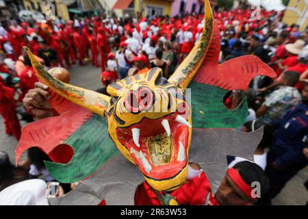 June 16, 2022, San Francisco de Yare, Venezuela: The Diablos de Yare walk on the streets of San Francisco de Yare during the celebration. Every year on the ninth Thursday after Holy Thursday the Diablos de Yare dance to celebrate Corpus Christi day Intangible Cultural Heritage of Humanity declared by UNESCO in 2012. Los Diablos de Yare dance through the streets of San Francisco de Yare in Miranda State, staging the triumph of good against evil. It is a tradition that has been going on for 234 years where faithful to the Catholic religion celebrate Corpus Christi Day in Venezuela. (Credit Image Stock Photo