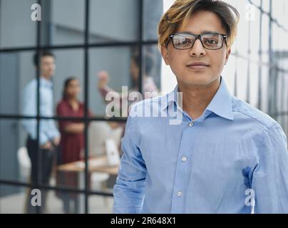 Male corporate leader ceo executive manager wearing glasses posing for business portra Stock Photo