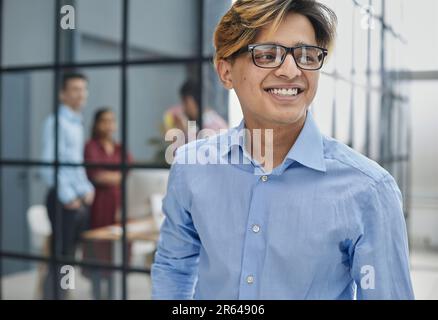Close-up caucasian serious puzzled clever guy student in glasses looking at camera posing indoors Stock Photo