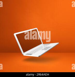 Blank computer laptop floating over an orange background. 3D isolated illustration. Square template Stock Photo