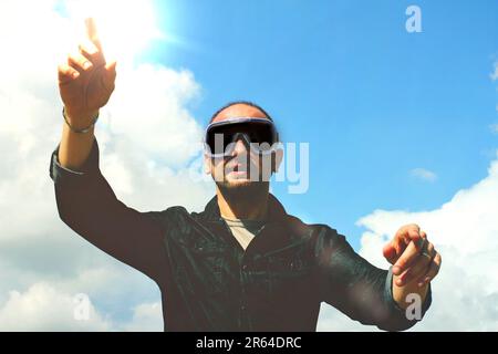 Young adult man wearing vr glasses for spatial computing Stock Photo
