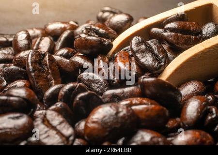 Dark roast coffee beans on a black background,  selective focus, and soft focus. Stock Photo