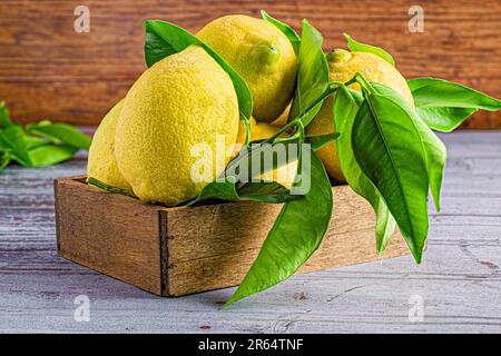 A pile of lemons in wooden box Stock Photo