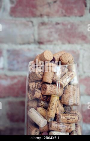 A glass filled with colorful wine corks Stock Photo