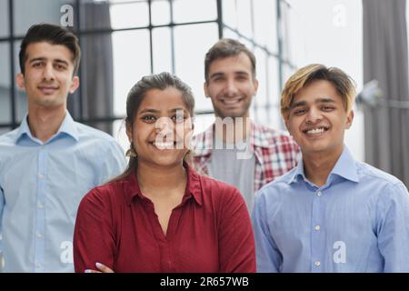 Theyre all about their business. Shot of a group of businesspeople standing in an office at work. Stock Photo