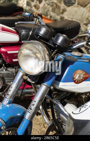 Sines, Portugal: 13.04.2023 Retro motorcycles parked on the street close up Stock Photo