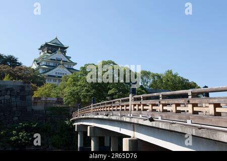 The castle tower and the Gokurakubashi Bridge Stock Photo