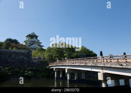 The castle tower and the Gokurakubashi Bridge Stock Photo