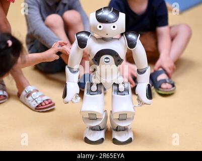 Karlsruhe, Germany. 07th June, 2023. The humanoid robot 'NAO' is introduced in the inclusive daycare center at the Lebenshilfehaus Karlsruhe. There, it accompanies the children in their everyday life. The project is part of the Real Lab Robotic AI of the Karlsruhe Institute of Technology (KIT), which makes artificial intelligence (AI) and robotics tangible for all people. Credit: Uli Deck/dpa/Alamy Live News Stock Photo