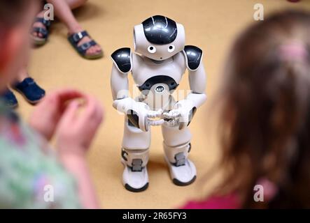 Karlsruhe, Germany. 07th June, 2023. The humanoid robot 'NAO' is introduced in the inclusive daycare center at the Lebenshilfehaus Karlsruhe. There, it accompanies the children in their everyday life. The project is part of the Real Lab Robotic AI of the Karlsruhe Institute of Technology (KIT), which makes artificial intelligence (AI) and robotics tangible for all people. Credit: Uli Deck/dpa/Alamy Live News Stock Photo