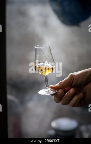 Close up shot of a hand holding a Arbikie single malt whisky glass Stock Photo