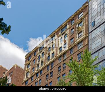 Emery Roth-designed 435 East 57th Street features rich cream-colored terra cotta ornamentation of its red brick façade. Stock Photo
