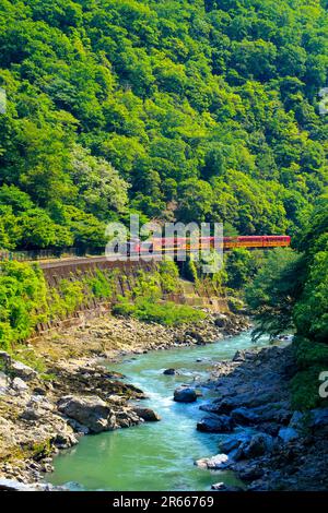 Sagano trolley train in the season of fresh green Stock Photo