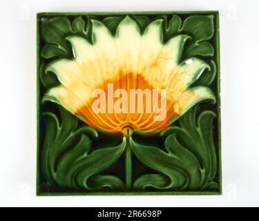 Antique 1900s Art Nouveau Minton stylised daisy flower pottery tile Stock Photo