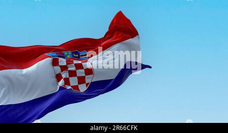 The national flag of Croatia waving in the wind on a clear day. Red, white and blue horizontal stripes with coat of arms in center. 3d illustration re Stock Photo