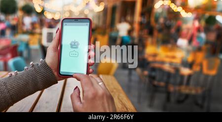 AI chat bot talking to user. Using artificial intelligence chat technology. Smartphone with AI app. Conversation with AI. New way of communication Stock Photo