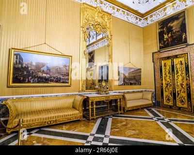 The Queen's room with his rare Rococo white and gilt stucco decoration ceiling and Neapolitans School paintings of the 17th-18th century - Royal Palace of Naples that In 1734 became the royal residence of the Bourbons - Naples, Italy Stock Photo