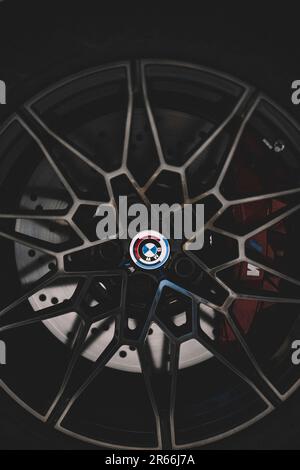 BMW wheel and tire with its logo in a last generation car. Stock Photo