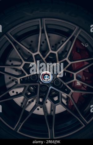 BMW wheel and tire with its logo in a last generation car. Stock Photo