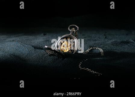 pocket watch on dark background Stock Photo