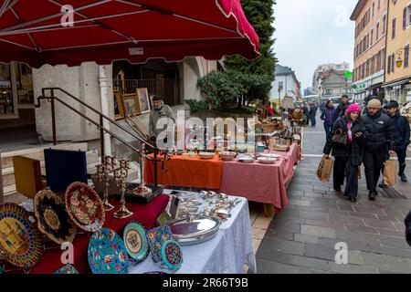 Annecy, France - January 29, 2022: People buying and selling at the old town market of Annecy, France. Stock Photo