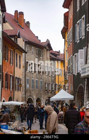 Annecy, France - January 29, 2022: People buying and selling at the old town market of Annecy, France. Stock Photo