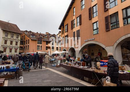 Annecy, France - January 29, 2022: People buying and selling at the old town market of Annecy, France. Stock Photo