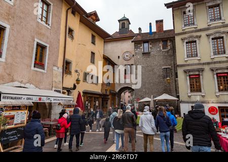 Annecy, France - January 29, 2022: People buying and selling at the old town market of Annecy, France. Stock Photo