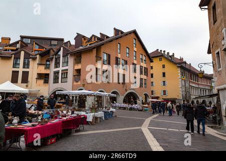 Annecy, France - January 29, 2022: People buying and selling at the old town market of Annecy, France. Stock Photo